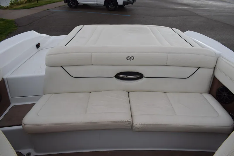 Slide: The Image of 2013 Cobalt 210 WSS boat with white leather seating and spacious deck. - 12