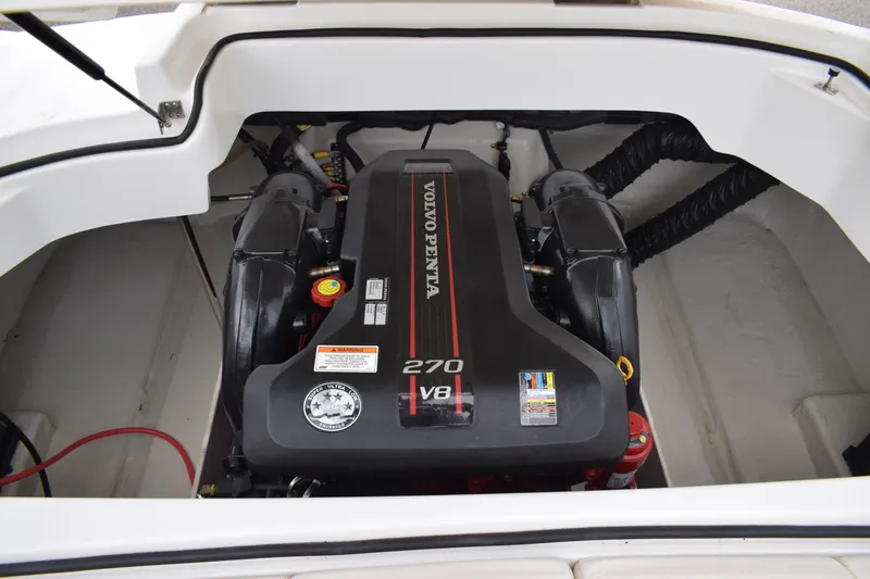 Slide: The Image of 2013 Cobalt 210 WSS boat engine compartment with Volvo Penta 270 V8 engine. - 13