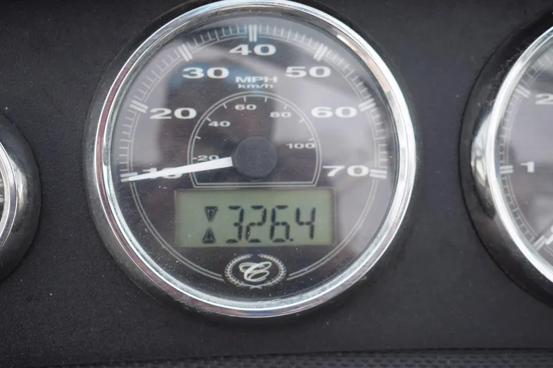 Slide: The Image of Speedometer of 2013 Cobalt 210 WSS showing 32.64 hours. - 14