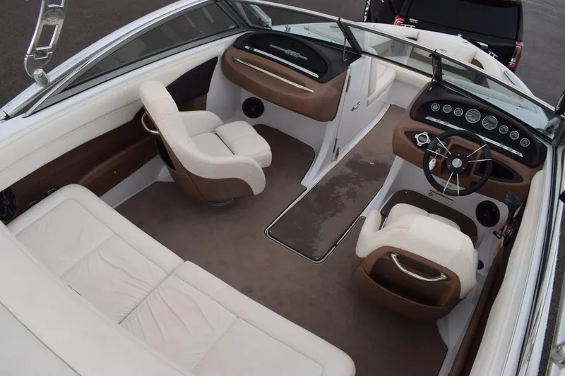 Slide: The Image of Interior of a 2013 Cobalt 210 WSS boat with white and brown seating. - 3