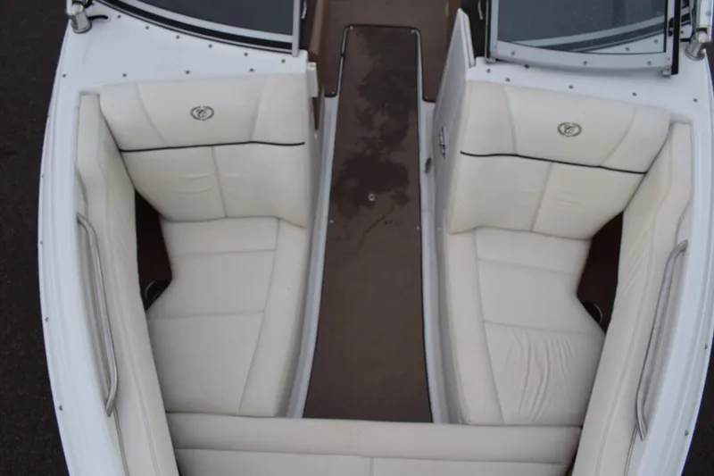 Slide: The Image of 2013 Cobalt 210 WSS boat interior with white leather seating. - 8