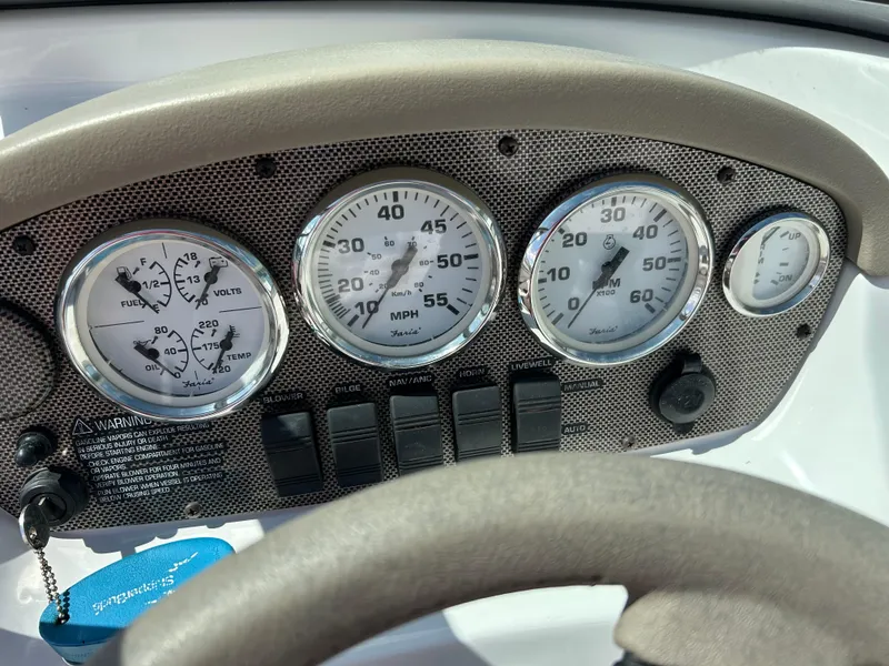 Slide: The Image of 2007 Four Winns 183 Horizon F&S boat dashboard with stereo system and logo. - 11