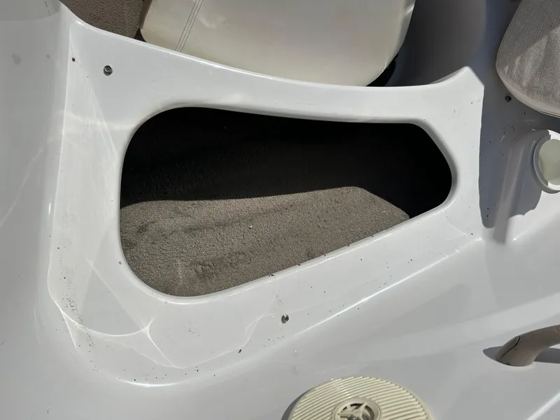 Slide: The Image of Interior detail of a 2007 Four Winns 183 Horizon F&S boat, showing seating and storage area. - 18