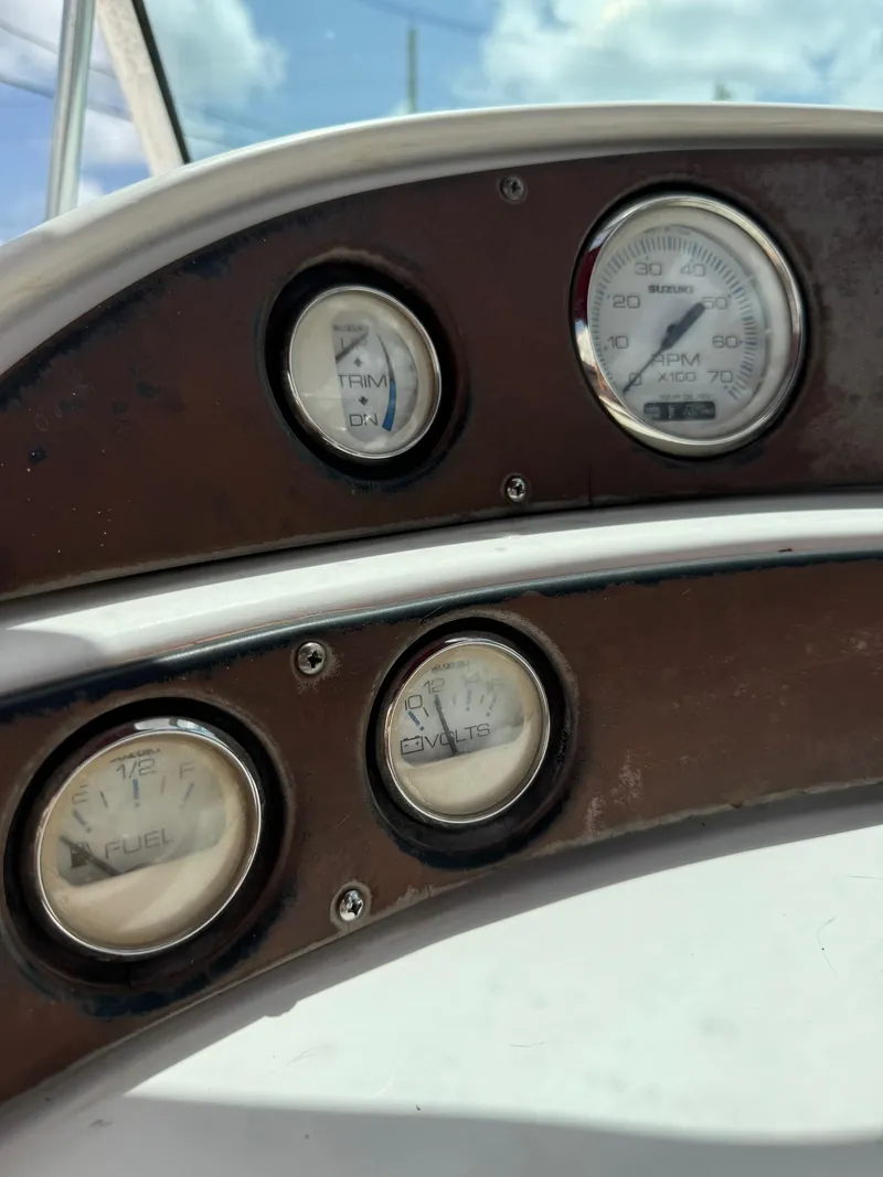 Slide: The Image of Dashboard gauges of a 1999 Hurricane 232 FUN DECK boat. - 10