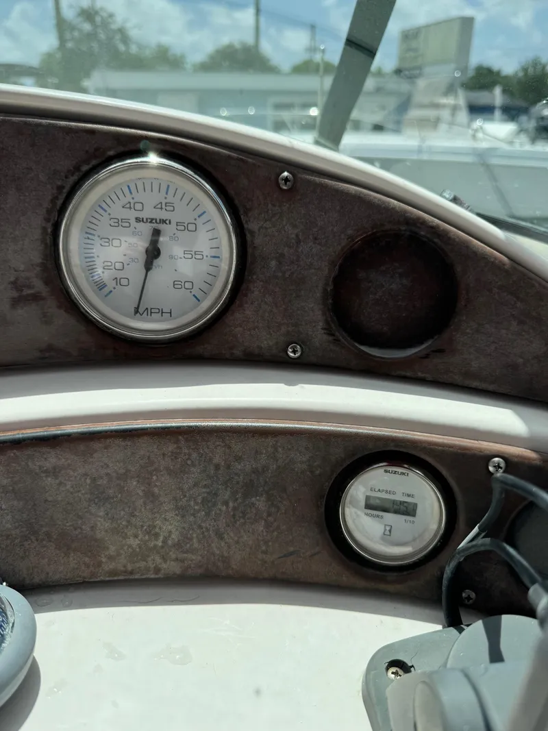 Slide: The Image of Close-up of the dashboard of a 1999 Hurricane 232 Fun Deck boat. - 11