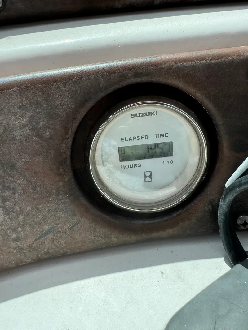 Slide: The Image of Suzuki elapsed time hour meter on 1999 Hurricane 232 Fun Deck boat. - 12