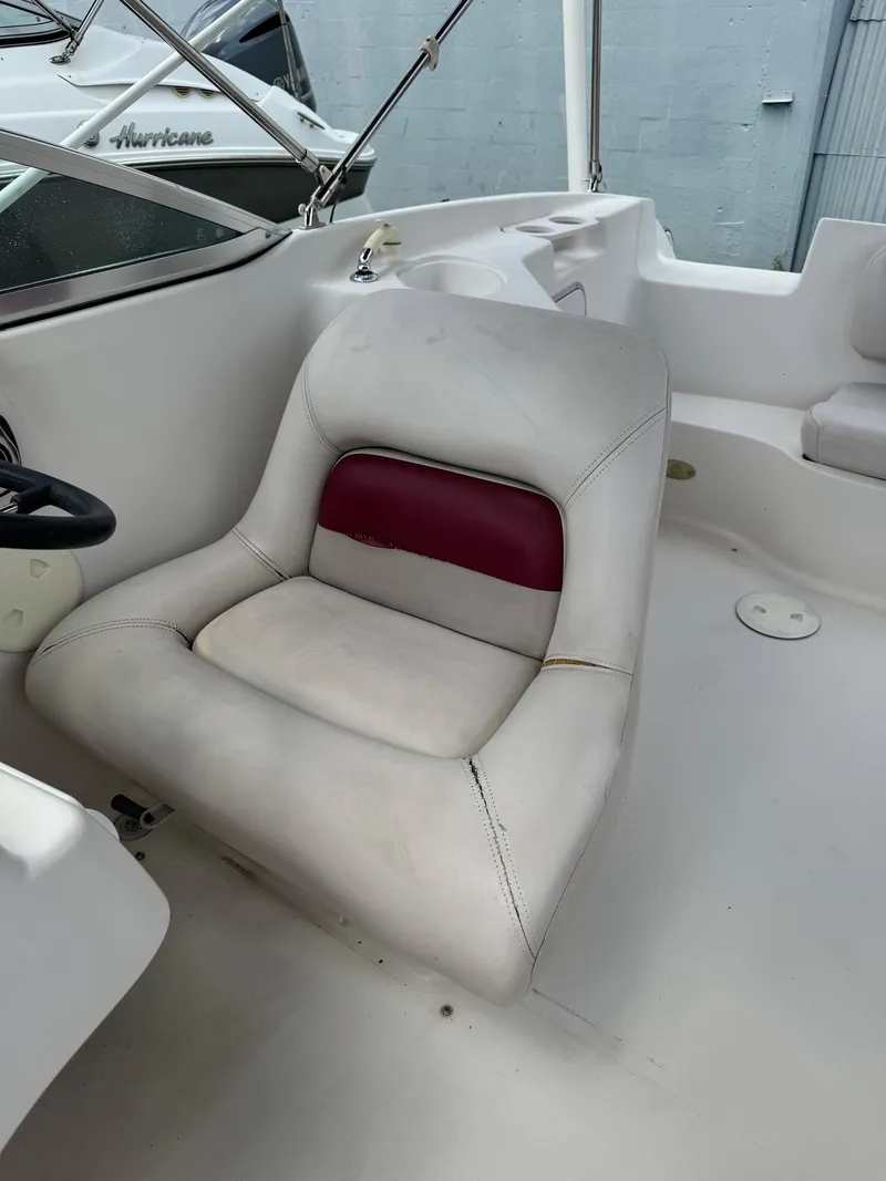 Slide: The Image of Captain's chair on a 1999 Hurricane 232 FUN DECK boat. - 16