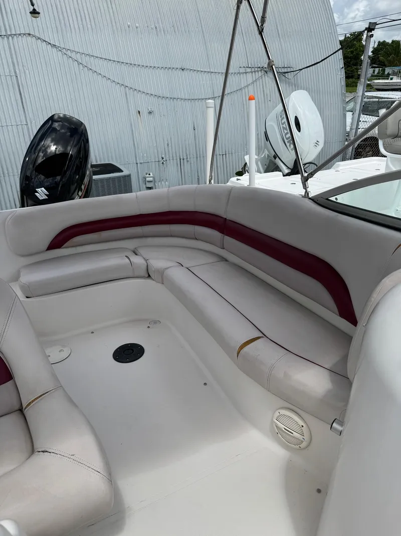 Slide: The Image of 1999 Hurricane 232 FUN DECK boat with white and red seating. - 17