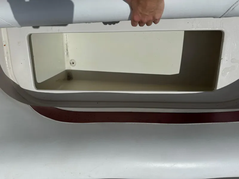 Slide: The Image of Storage compartment of a 1999 Hurricane 232 FUN DECK boat. - 23