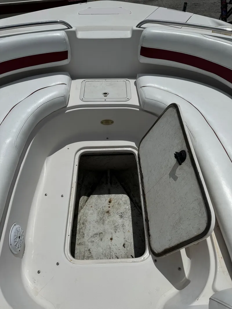 Slide: The Image of 1999 Hurricane 232 FUN DECK boat with open storage compartment. - 24