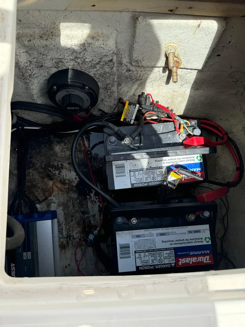 Slide: The Image of Battery compartment of a 1999 Hurricane 232 FUN DECK boat. - 29