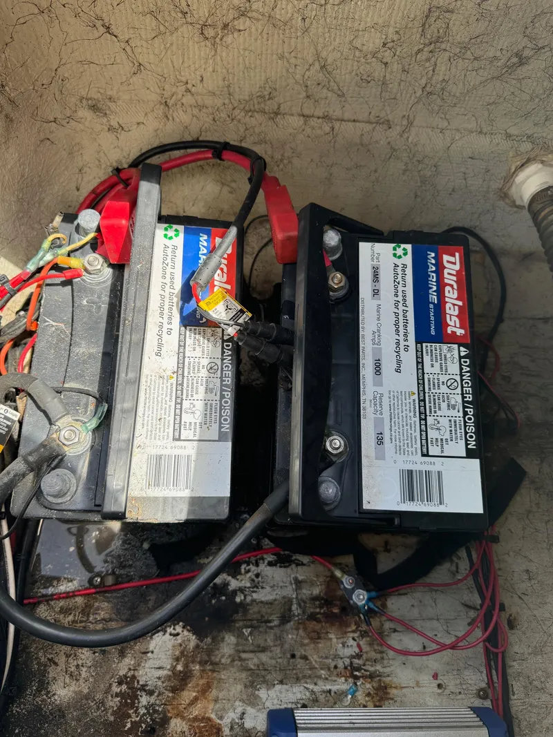Slide: The Image of Two marine batteries in a 1999 Hurricane 232 FUN DECK boat. - 31