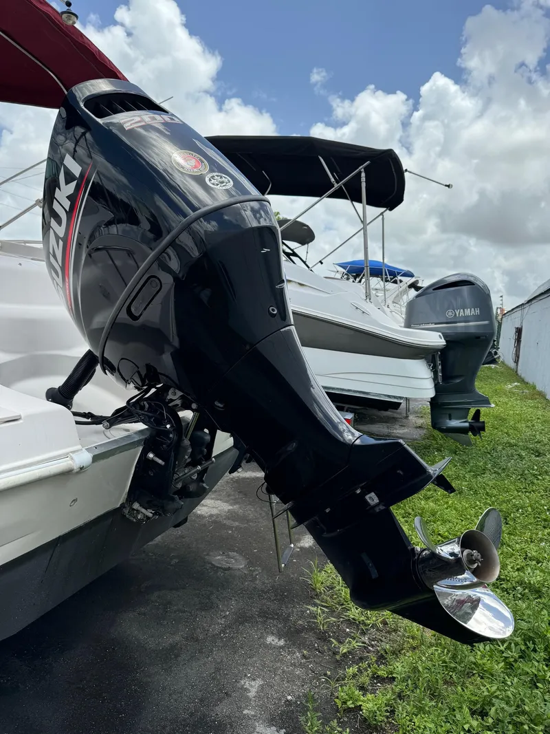 Slide: The Image of 1999 Hurricane 232 FUN DECK with Suzuki outboard motor. - 34