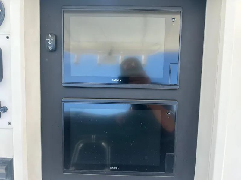 Slide: The Image of Dual Garmin displays on 2013 Stamas 317 Tarpon boat dashboard. - 23