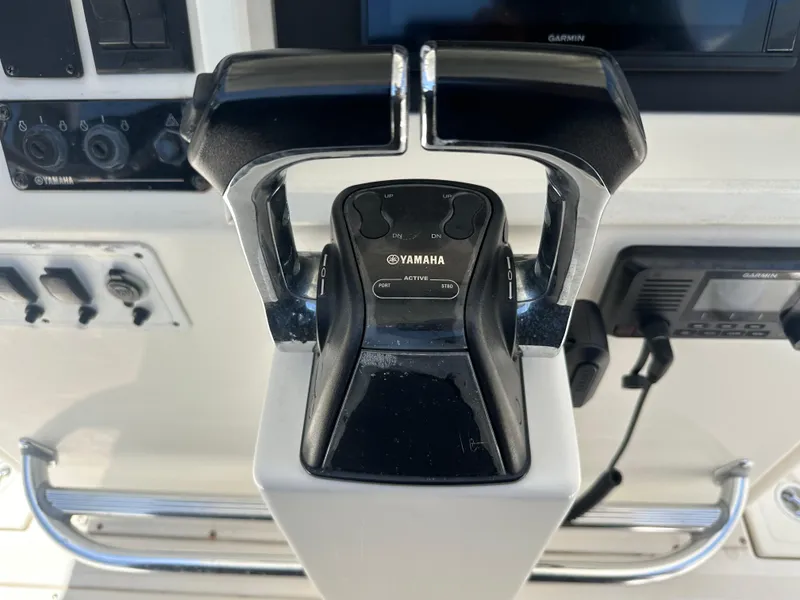 Slide: The Image of Yamaha throttle controls on a 2013 Stamas 317 Tarpon boat. - 29