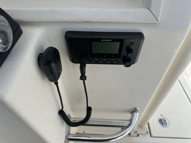 Slide: The Image of Garmin marine radio on 2013 Stamas 317 Tarpon boat console. - 30