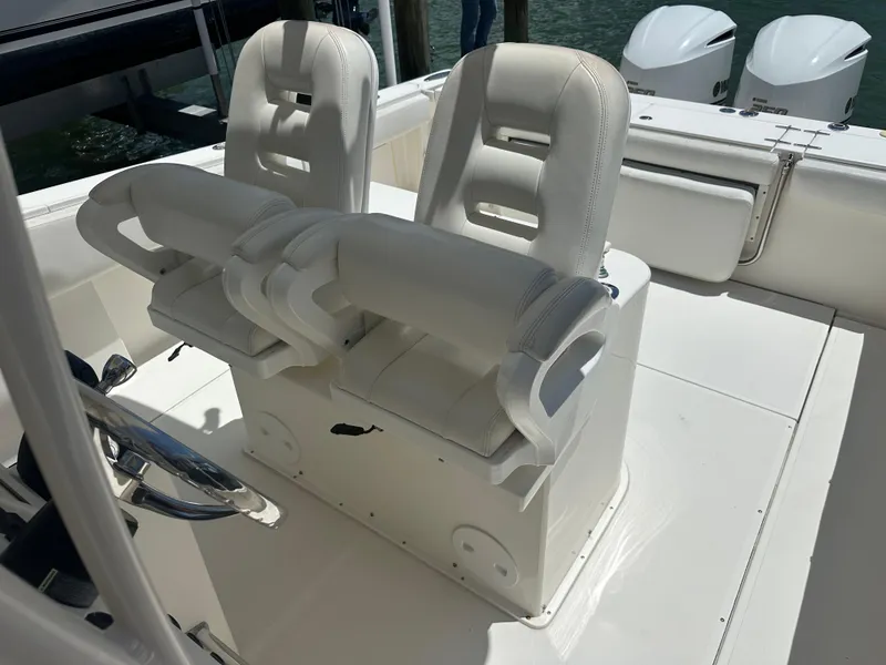 Slide: The Image of 2013 Stamas 317 Tarpon boat with dual white captain's chairs. - 32