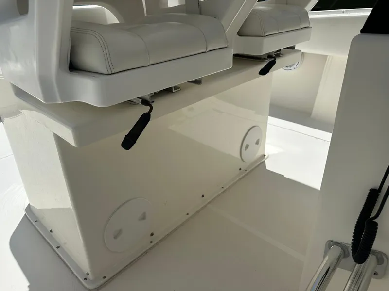 Slide: The Image of 2013 Stamas 317 Tarpon boat seating area with white cushioned seats. - 33