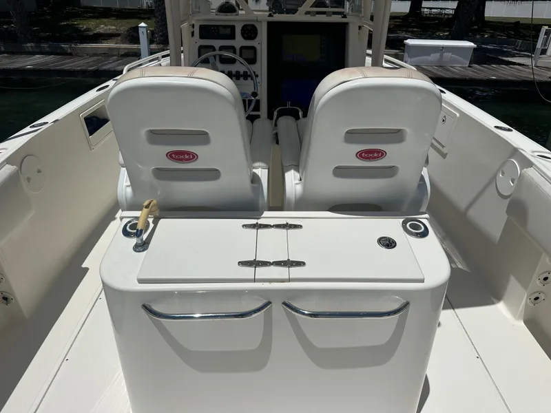 Slide: The Image of 2013 Stamas 317 Tarpon boat interior with dual captain seats and control panel. - 34