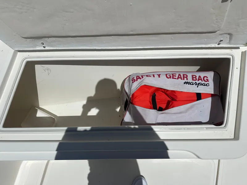 Slide: The Image of 2013 Stamas 317 Tarpon storage compartment with safety gear bag. - 38