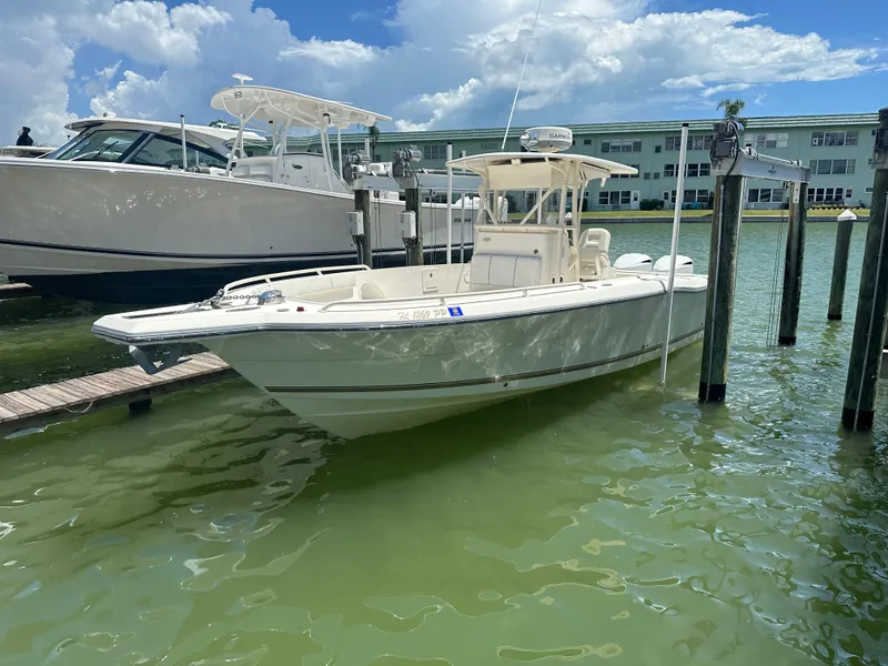 Slide: The Image of 2013 Stamas 317 Tarpon boat docked in marina with clear skies. - 4