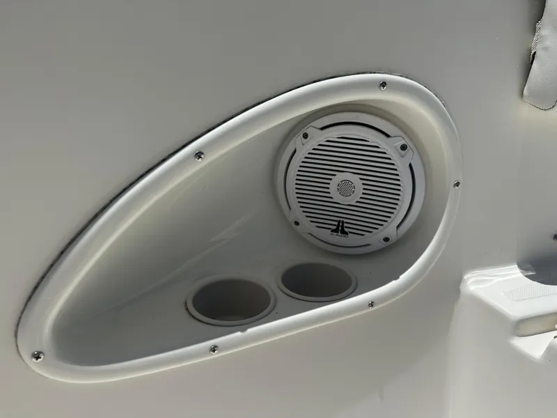 Slide: The Image of Close-up of speaker and cup holders on 2013 Stamas 317 Tarpon boat. - 40