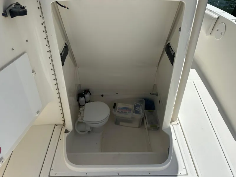 Slide: The Image of 2013 Stamas 317 Tarpon boat interior with toilet and storage. - 45