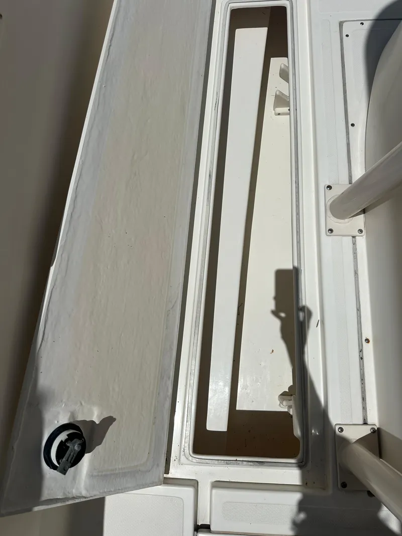 Slide: The Image of Open storage compartment on a 2013 Stamas 317 Tarpon boat. - 47