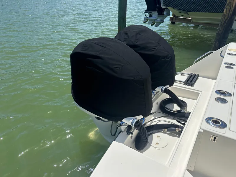 Slide: The Image of 2013 Stamas 317 Tarpon boat with covered outboard motors in water. - 9