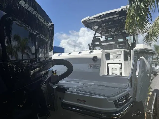 Slide: The Image of 2025 Blackfin 332cc boat with storage compartments and coolers. - 13