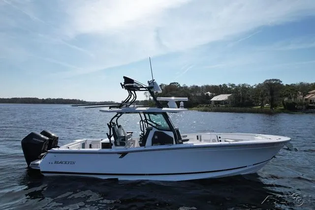 Slide: The Image of 2025 Blackfin 332cc boat side view with logo. - 3