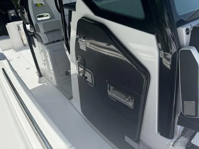 Slide: The Image of 2025 Blackfin 332cc boat interior with compact bathroom and sink. - 45