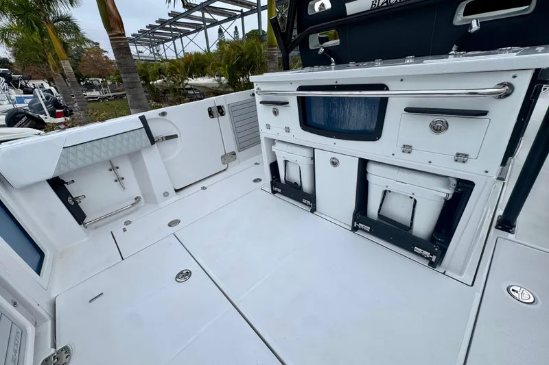 Slide: The Image of 2025 Blackfin 332 CC boat deck with storage compartments and seating. - 71