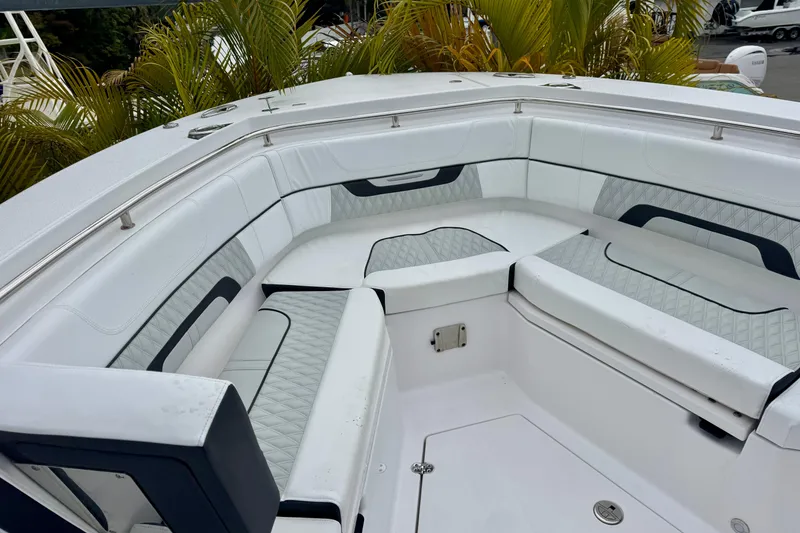 Slide: The Image of Luxurious seating area on 2025 Blackfin 332 CC boat, featuring elegant white upholstery. - 81
