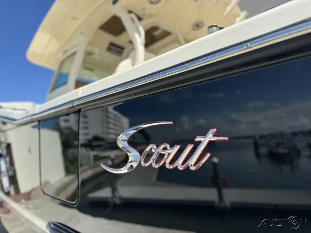 Slide: The Image of 2022 Scout 330 LXF boat docked at marina, close-up of logo. - 20