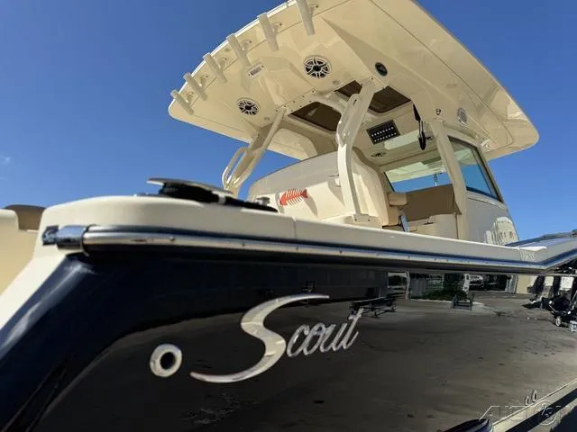 Slide: The Image of 2022 Scout 330 LXF boat, close-up view of the deck and logo. - 26