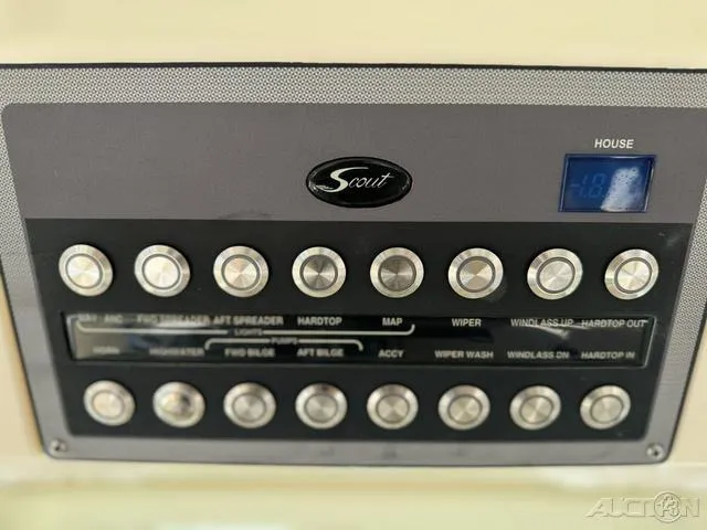 Slide: The Image of Control panel of a 2022 Scout 330 LXF boat with various buttons and digital display. - 40