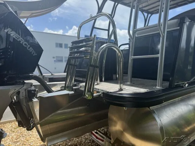 Slide: The Image of 2024 Avalon Catalina Entertainer Funship 27 FT rear view with ladder and Mercury engine. - 11