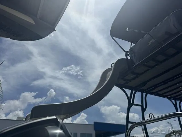 Slide: The Image of 2024 Avalon Catalina Entertainer Funship 27 FT with slide, under a sunny sky. - 16