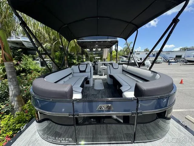Slide: The Image of 2024 Avalon Catalina Entertainer Funship 27 FT pontoon boat, spacious seating, black canopy. - 19