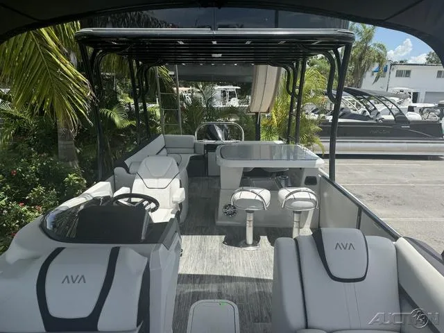 Slide: The Image of 2024 Avalon Catalina Entertainer Funship 27 FT interior with seating and table. - 26