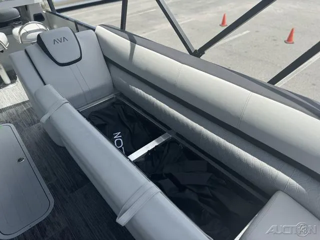 Slide: The Image of 2024 Avalon Catalina Entertainer Funship 27 FT interior seating with storage compartment. - 29