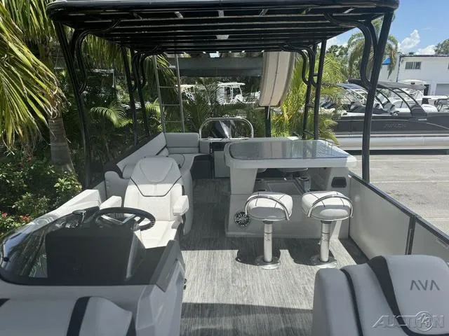 Slide: The Image of 2024 Avalon Catalina Entertainer Funship 27 FT interior with seating and table. - 30