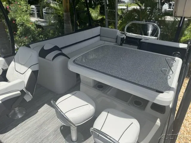 Slide: The Image of Interior of 2024 Avalon Catalina Entertainer Funship 27 FT with seating and table. - 34