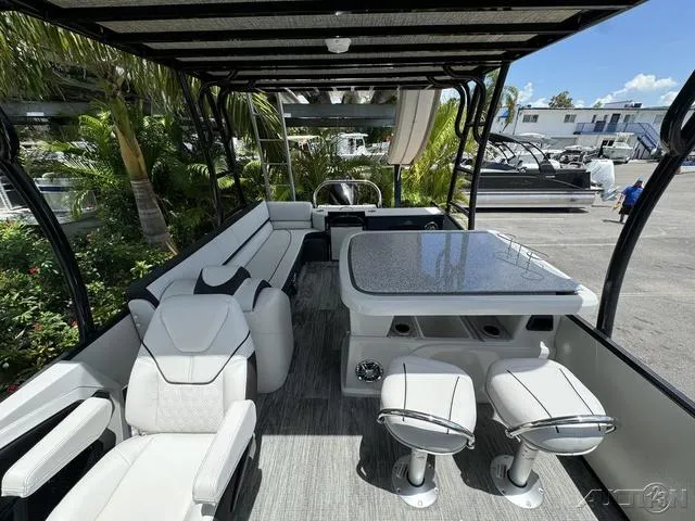 Slide: The Image of 2024 Avalon Catalina Entertainer Funship 27 FT interior with seating and table. - 36