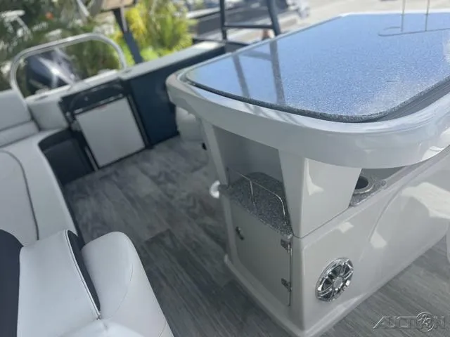 Slide: The Image of Interior of 2024 Avalon Catalina Entertainer Funship 27 FT with modern seating and table. - 40