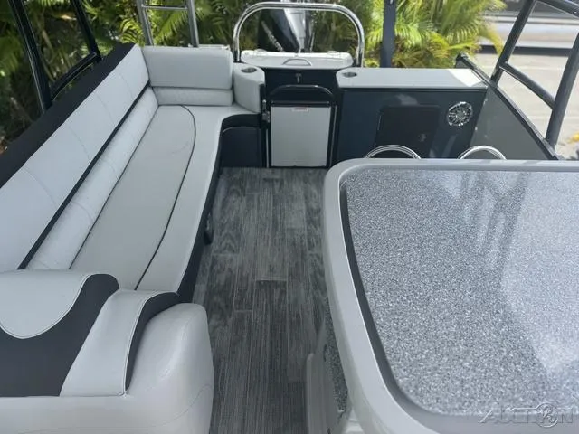 Slide: The Image of 2024 Avalon Catalina Entertainer Funship 27 FT interior with seating and table. - 41