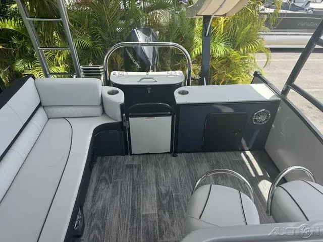 Slide: The Image of 2024 Avalon Catalina Entertainer Funship 27 FT interior with seating and storage. - 43