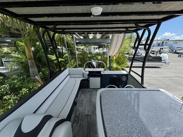 Slide: The Image of 2024 Avalon Catalina Entertainer Funship 27 FT interior with seating and table. - 44