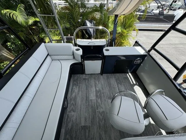 Slide: The Image of 2024 Avalon Catalina Entertainer Funship 27 FT interior with seating and helm station. - 46